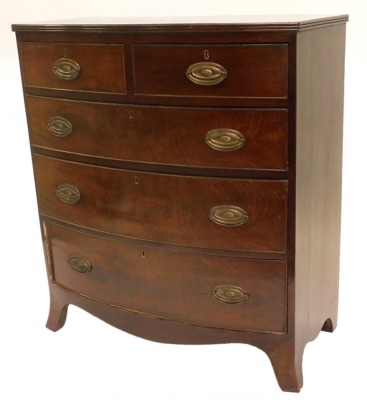 A Victorian mahogany bowfronted chest of drawers, the top with a crossbanded and boxwood strung border, above two short and three long drawers with later oval brass handles and splayed feet, 89cm wide.