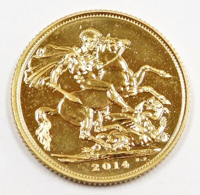 An Elizabeth II full gold sovereign, dated 2014, in plastic coin casing.