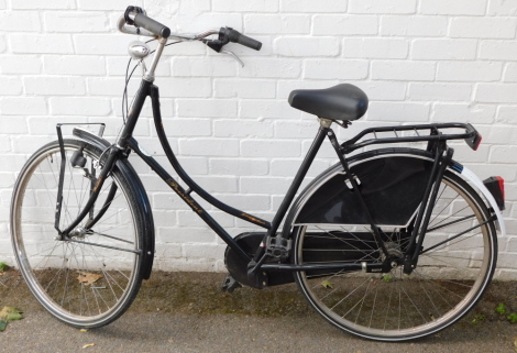 A Holland Classic President lady's bicycle, retro style with black frame, basket to the front.