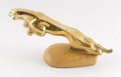 A brass desk stand, modelled as a Jaguar car mascot, 18.5cm wide. - 2