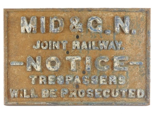 A Midland and Great Northern cast iron railway sign, Joint Railway Notice Trespasses will be Prosecuted, formerly at the station at Pode Hole, 48cm long.