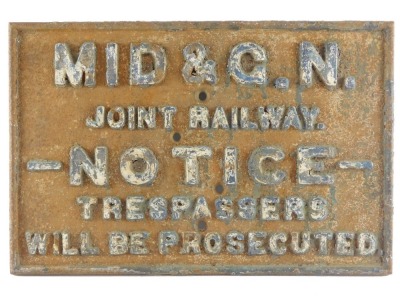 A Midland and Great Northern cast iron railway sign, Joint Railway Notice Trespasses will be Prosecuted, formerly at the station at Pode Hole, 48cm long.