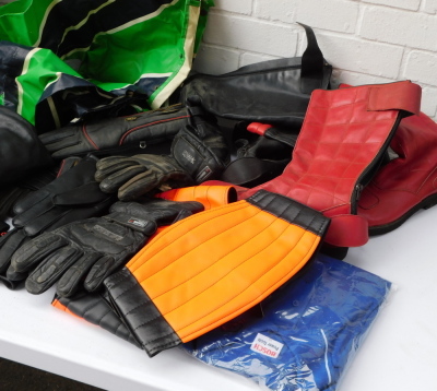 Assorted motorcycle boots, gloves and clothing, together with an AGV X3000 fibreglass motorcycle helmet, and a further motorcycle helmet. (2 boxes) - 2