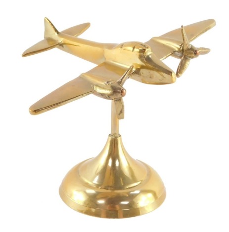 An aeronautical brass desk stand, modelled as an Avro Anson, 15cm wide.