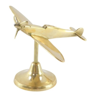 An aeronautical brass desk stand, modelled as a Spitfire, 16.5cm wide.