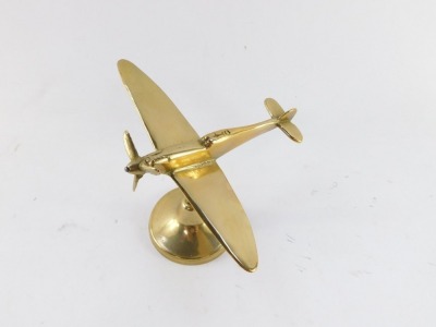 An aeronautical brass desk stand, modelled as a Spitfire, 16.5cm wide. - 2