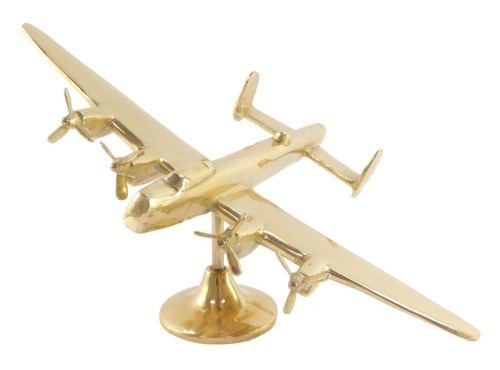 A brass aeronautical desk stand, modelled as a Avro Lancaster, 24cm wide.