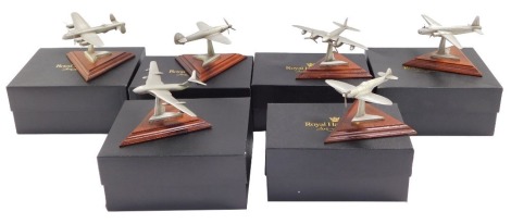 Six Royal Hampshire Art Foundry models of fighter and bomber aircraft, raised on wooden stands, boxed.