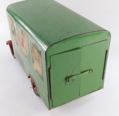 A Tri-ang tin plate transport van, number 200, with a red cab and green covered wagon, bearing advertising labels, registration LB2121, 48cm wide. - 4