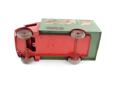 A Tri-ang tin plate transport van, number 200, with a red cab and green covered wagon, bearing advertising labels, registration LB2121, 48cm wide. - 5