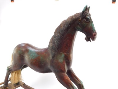 A vintage style carved wooden rocking horse, with horse hair tail, raised on a sleigh type base, 60cm high, 82.5cm wide. - 4