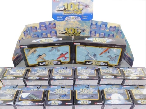 A Corgi die cast Showcase Collection One Hundred Years of Flight, comprising Global Traveller., The Pioneering Years., Four Aces at War., Top Gun and The Space Race, boxed, together with a display stand. (15)