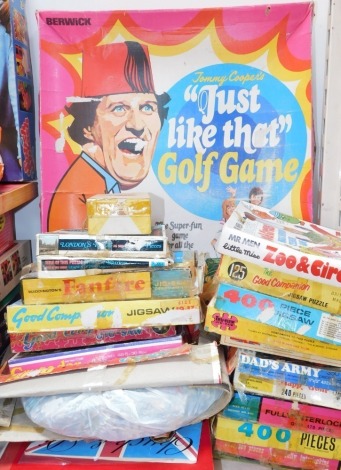 A Berwick Tommy Coopers 'Just Like That' golf game, together with Waddingtons and other jigsaw puzzles, and games, most boxed. (a quantity)