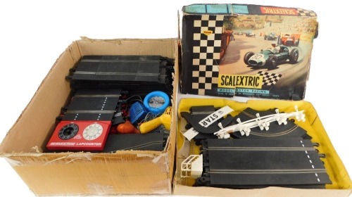 A Scalextric model motor racing set, lacking cars, boxed, together with First Scalextric. (a quantity) (AF)