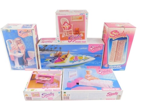 A group of Sindy accessories, boxed, comprising a rocking chair, vanity set, wardrobe, bedroom set, hostess trolley and a speedboat. (6)