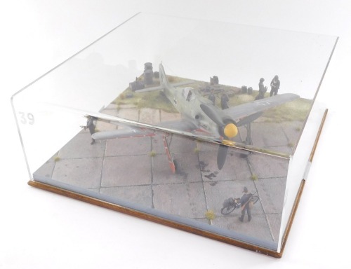 A diorama of a World War II Focke Wulf 190, pilot Lt. Heinz Sachsenberg, W.Nr.600424 with figures, perspex cased.