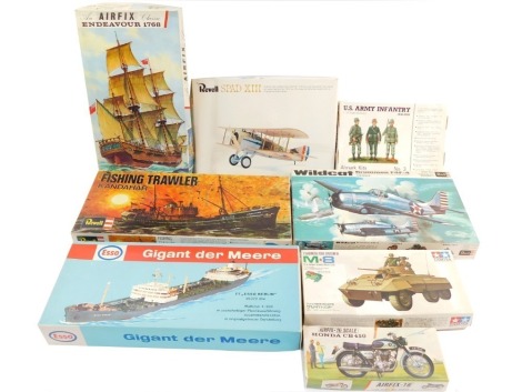 Revell Airfix and other model kits, including US Army infantry, a US Army armored car, Endeavour 1768, fishing trawler Kandahar, Esso fuel tanker Berlin, and a wild cat Grumman F4F-4, all boxed. (8)