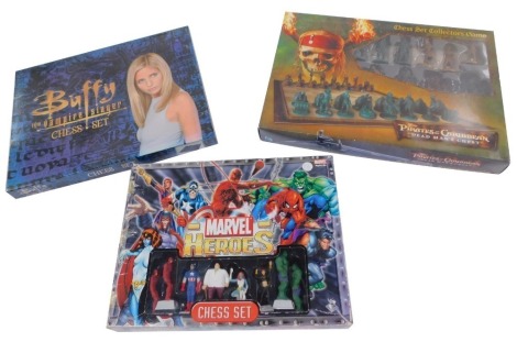 A Disney Pirates of The Caribbean chess set Collector's Game, Dead Man's Chest., Buffey The Vampire Slayer chess set., and a Marvel Heroes chess set, all boxed. (3)