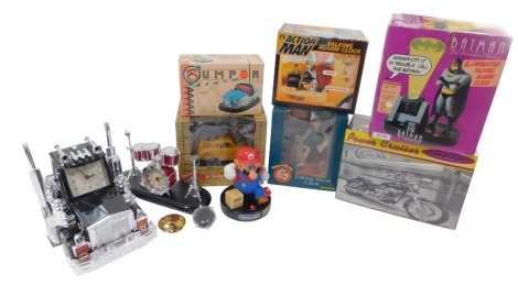 Seven collectable clocks, comprising a Batman Animated Series illuminated talking alarm clock., Snow Tigers clock., Super Mario clock., bumper car clock., Only Fools & Horses 3D talking alarm clock., Action Man clock., and a Power Cruiser time machine clo