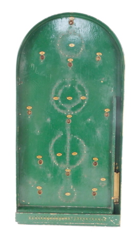 A vintage green painted bagatelle game, with twelve ball bearings.