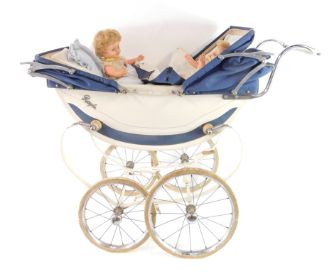 A Royale coach built twins pram, with a cream chassis and blue fabric hoods, together with two Pedigree dolls, in original clothing.