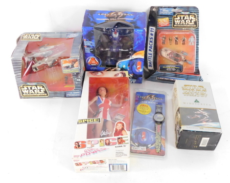 A Lost in Space rocket launcher robot, Star Wars Action Fleet A-Wing Starfighter., Cantina Encounter Land Speeder with poseable action figures., Star Wars Trilogy three VHS cassette set., Galoob Spice Girls Ginger Spice, and a Lost In Space LCD watch, all