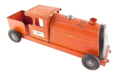 A Tri-ang Express tin plate locomotive, red livery, 54cm wide.