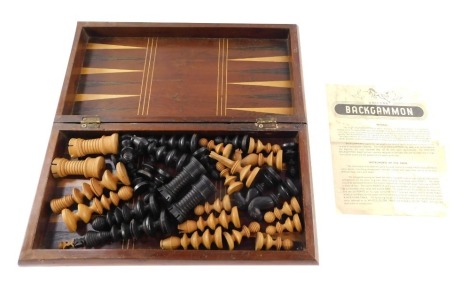 A late 19thC style turned wooden chess set, queen 89mm high, King 125mm high, contained within a stained yew wood and boxwood lined inlaid fold over chess board with internal backgammon board, 38cm wide, 37cm deep.