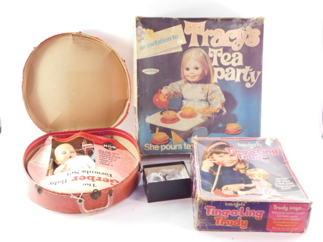 A Palitoy Tracy's Tea Party, Bradgate Ting A Ling Trudy, both boxed, together with Gerber Baby Formula set, cased and a child's teaset.