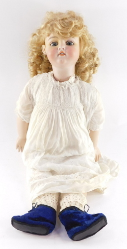 A Franz Schmidt bisque head doll no. 12, modelled with blue eyes, open mouth, pierced ears.