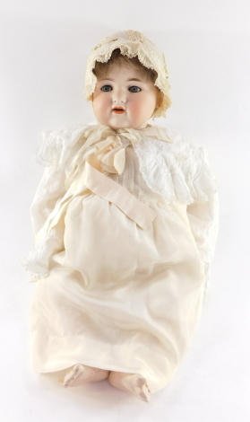 An Armand Marseille bisque head doll no. 990, A12M, modelled with blue eyes, open mouthed.