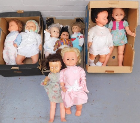 A group of plastic dolls, each of varying design but large in proportion, with varying dress. (3 boxes)