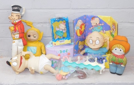 A group of collectors toys, to include a Teletubbies yellow Teletubby figure, a Rugrats Child, a Rugrats collectible, various other Polly Pocket accessories, a Sunny Jim collectors figure, etc. (a quantity)