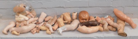 A quantity of various ceramic doll parts.