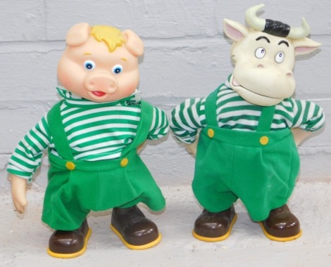 Two plastic rocker models, of a cow and pig in green dungarees, stamped Made In China.