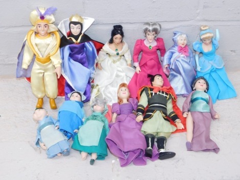 A group of Disney related figures, Aladdin, Snow White, Fairy Godmother from Cinderella, and various others, each with porcelain heads. (1 box)