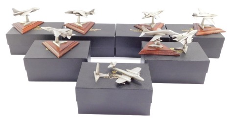 Eight Royal Hampshire Art Foundry models of fighter aircraft, raised on wooden stands, 7 boxed.