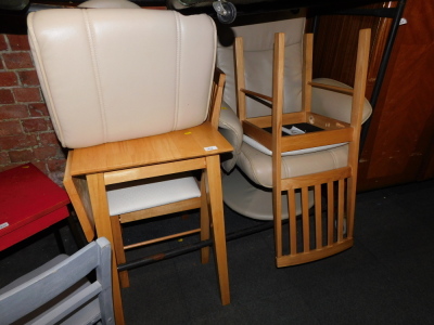 A cream leather reclining armchair and footstool, together with a table and two chairs. (5) - 2