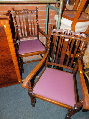 A pair of early 20thC oak carver dining chairs, with crown carved back rails, raised on barley twist legs. - 2