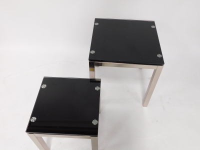 A pair of graduated brushed metal and smoked glass occasional tables, each of plain form, 56cm high, 50cm wide, and 43cm high, 40cm wide respectively. - 4