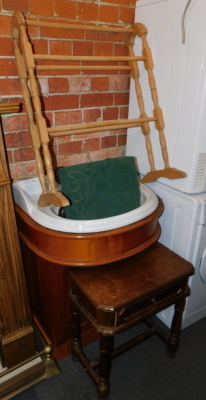 A bathroom sink, with fitted cabinet, towel rail, stool and a side table. (4)