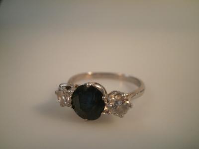 A sapphire and diamond three stone ring