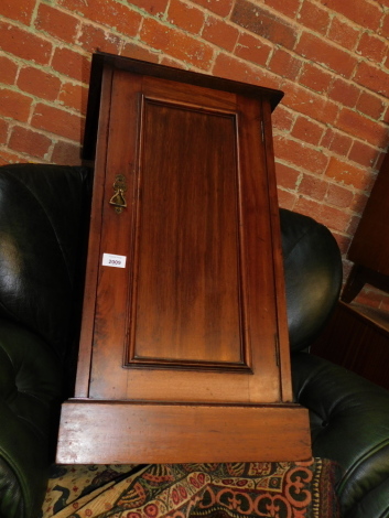 A Victorian walnut pot cupboard.