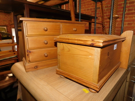 A pine miniature chest of drawers, together with a pine casket. (2)