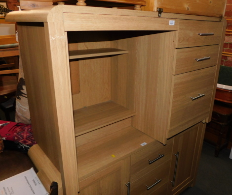 An oak effect desk with steel handles.