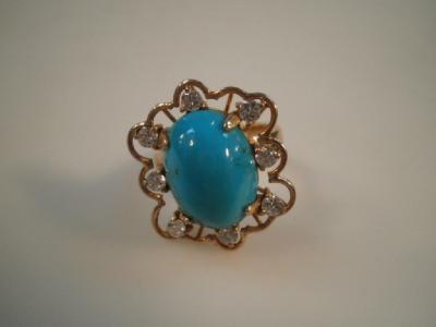 A turquoise and diamond set ring