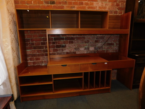 An extendable teak wall unit.