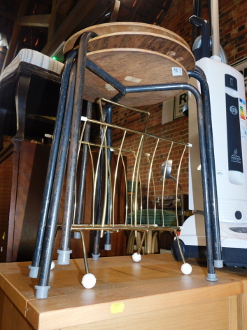 Three mid 20thC bent plywood and metal framed stools, together with a gilt metal magazine rack. (4)