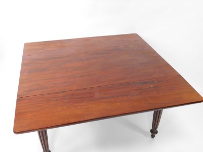 A Victorian mahogany drop leaf dining table, with reeded legs, 121cm wide, 124cm long when extended. - 2