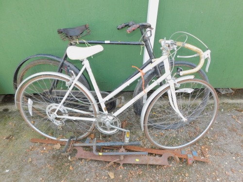 A Raleigh vintage bicycle, together with an unmarked bicycle, black, two sash cramps, etc. (a quantity)